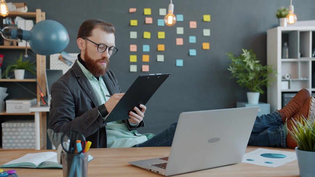 professional man reading book in office
