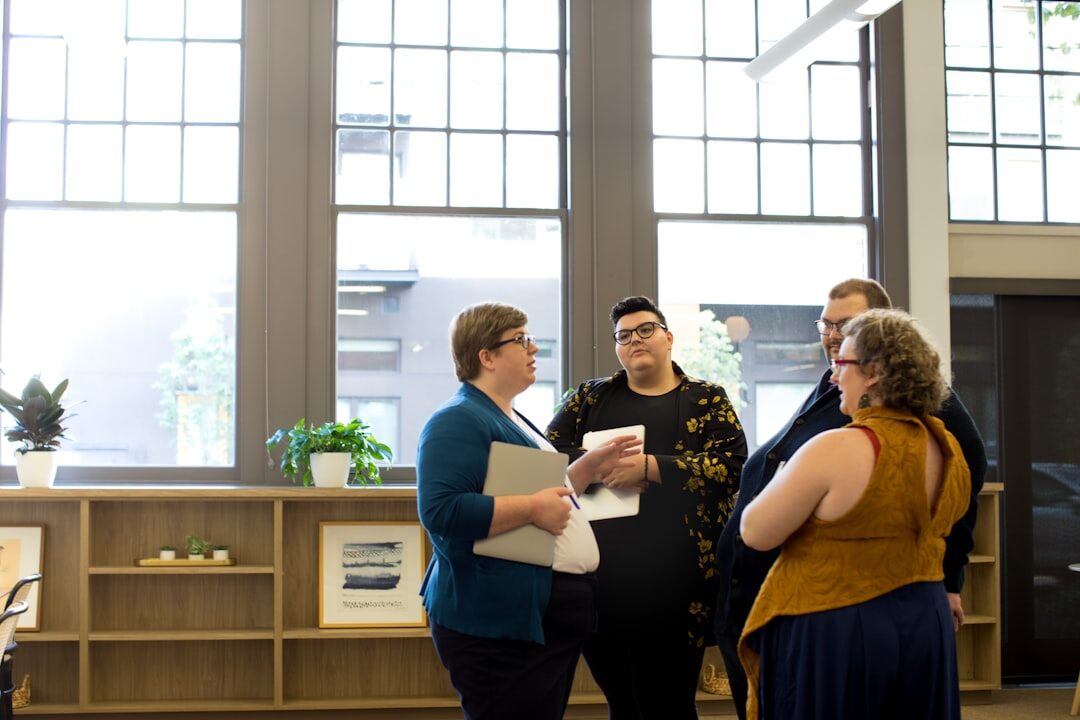 people having conversation in office