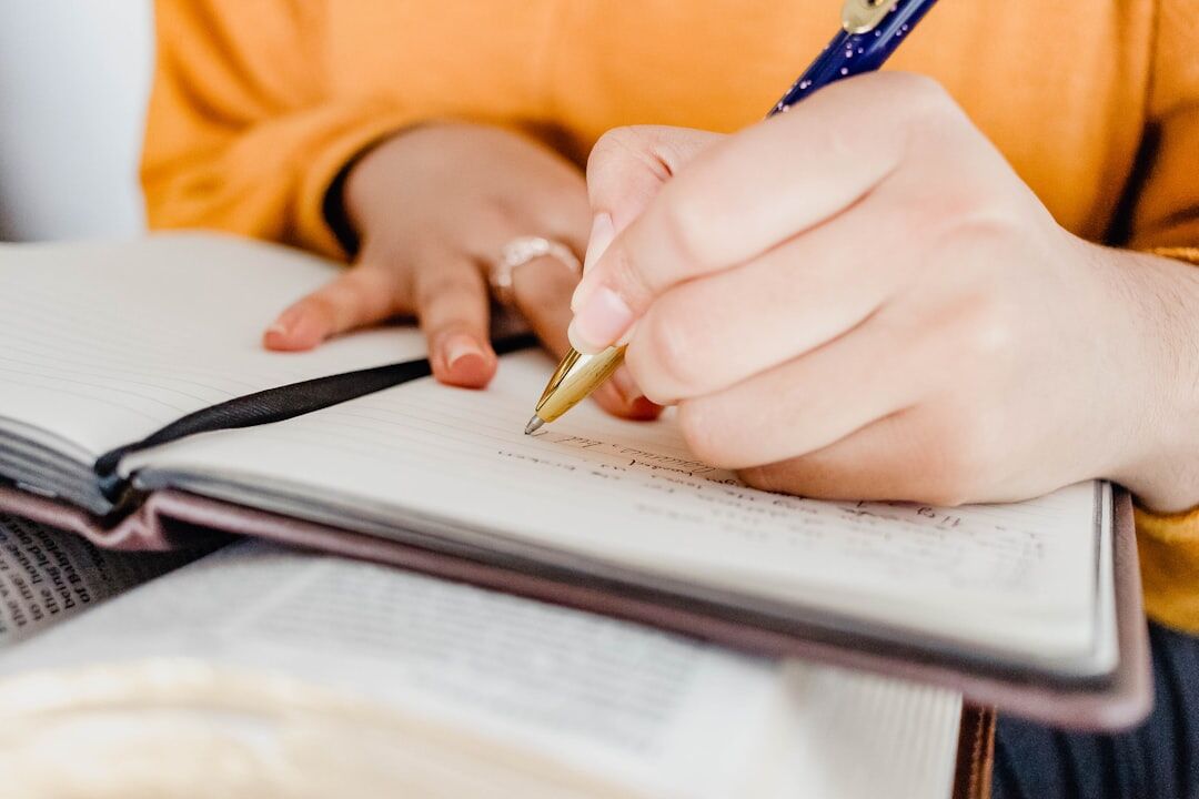 woman writing in notebook