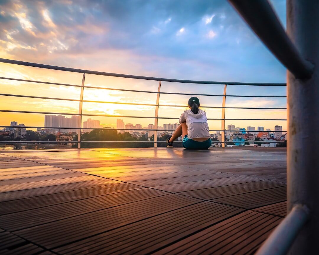 person meditating at sunrise